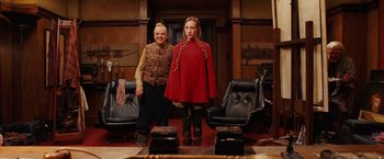 Movie still from “City of Ember” (2008), directed by Gil Kenan – A woman and a man standing next to each other in a room; Medium shot, Low angle