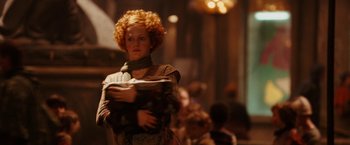 Movie still from “City of Ember” (2008), directed by Gil Kenan – A woman with red hair holding something in her hands; Medium shot, Low angle