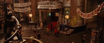 Movie still from “City of Ember” (2008), directed by Gil Kenan – A group of people standing in front of a building; Extreme Wide shot, High angle