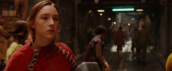 Movie still from “City of Ember” (2008), directed by Gil Kenan – A woman in a red dress is sitting on a chair; Close Up shot, Over the shoulder angle