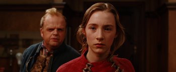 Movie still from “City of Ember” (2008), directed by Gil Kenan – A woman in a red shirt and a man in a black shirt; Close Up shot, Over the shoulder angle