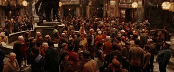 Movie still from “City of Ember” (2008), directed by Gil Kenan – A group of people standing in a room; Wide shot, High angle