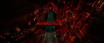 Movie still from “City of Ember” (2008), directed by Gil Kenan – An overhead view of an industrial building with a river running through it; Extreme Wide shot, High angle