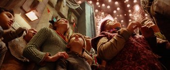 Movie still from “City of Ember” (2008), directed by Gil Kenan – A group of people standing next to each other; Medium shot, Low angle