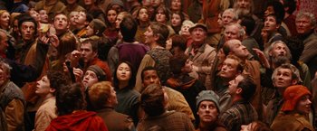 Movie still from “City of Ember” (2008), directed by Gil Kenan – A group of people standing around each other in a room; Wide shot, High angle