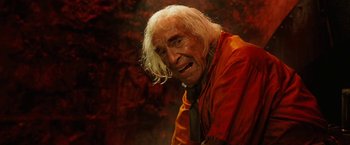 Movie still from “City of Ember” (2008), directed by Gil Kenan – An old man with long white hair wearing a tie; Close Up shot, High angle