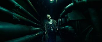 Movie still from “City of Ember” (2008), directed by Gil Kenan – An older man standing in a dark room; Wide shot, Low angle