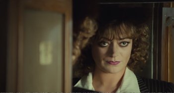 Movie still from “City of Women” (1980), directed by Federico Fellini – A person in a mirror; Close Up shot, Over the shoulder angle