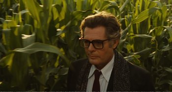 Movie still from “City of Women” (1980), directed by Federico Fellini – A person wearing a suit and tie; Close Up shot, Over the shoulder angle