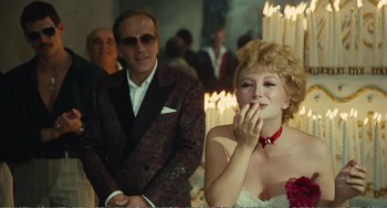 Movie still from “City of Women” (1980), directed by Federico Fellini – A man and a woman in formal wear; Medium shot, Over the shoulder angle