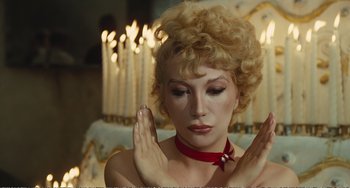 Movie still from “City of Women” (1980), directed by Federico Fellini – A woman with her eyes closed and her hands in prayer; Close Up shot, High angle