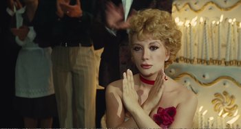 Movie still from “City of Women” (1980), directed by Federico Fellini – A person wearing a dress; Medium shot, Over the shoulder angle