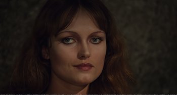 Movie still from “City of Women” (1980), directed by Federico Fellini – A person with green eyes; Close Up shot, High angle