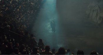 Movie still from “City of Women” (1980), directed by Federico Fellini – Two people standing in the middle of an audience; Extreme Wide shot, High angle