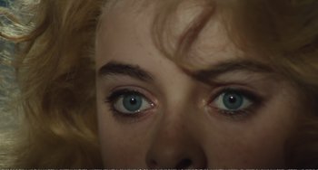 Movie still from “City of Women” (1980), directed by Federico Fellini – A woman's eyes with blue eyes; Extreme Close Up shot, Overhead angle