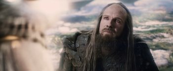 Movie still from “Clash of the Titans” (2010), directed by Louis Leterrier – A man with long hair and a long beard; Close Up shot, Low angle