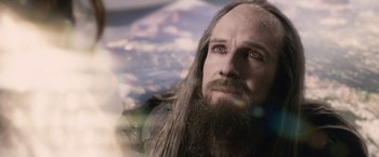 Movie still from “Clash of the Titans” (2010), directed by Louis Leterrier – A man with long hair and a long beard; Close Up shot, Over the shoulder angle