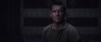 Movie still from “Clash of the Titans” (2010), directed by Louis Leterrier – A person wearing a sweater; Close Up shot, Over the shoulder angle