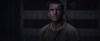 Movie still from “Clash of the Titans” (2010), directed by Louis Leterrier – A person wearing a shirt; Close Up shot, Over the shoulder angle