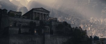 Movie still from “Clash of the Titans” (2010), directed by Louis Leterrier – A large building with pillars on top of a hill; Extreme Wide shot, Low angle