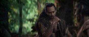 Movie still from “Clash of the Titans” (2010), directed by Louis Leterrier – A man with long black hair and a beard; Medium shot, Over the shoulder angle