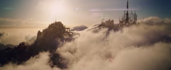 Movie still from “Clash of the Titans” (2010), directed by Louis Leterrier – A view of a mountain with a cloud filled sky in the background; Extreme Wide shot, Low angle