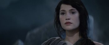Movie still from “Clash of the Titans” (2010), directed by Louis Leterrier – A person with long black hair; Close Up shot, Over the shoulder angle