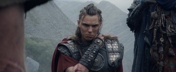 Movie still from “Clash of the Titans” (2010), directed by Louis Leterrier – A man in a viking costume with a scar on his face; Close Up shot, Low angle