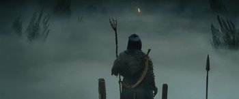 Movie still from “Clash of the Titans” (2010), directed by Louis Leterrier – A man holding a stick in the fog; Wide shot, High angle