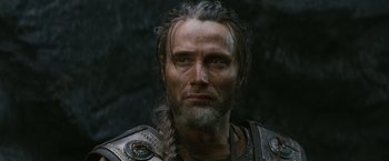 Movie still from “Clash of the Titans” (2010), directed by Louis Leterrier – A person with a beard; Close Up shot, Over the shoulder angle
