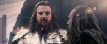 Movie still from “Clash of the Titans” (2010), directed by Louis Leterrier – A man with long hair and a beard looking into a mirror; Close Up shot, Over the shoulder angle