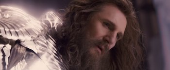 Movie still from “Clash of the Titans” (2010), directed by Louis Leterrier – A man with long hair and a long beard; Close Up shot, Low angle