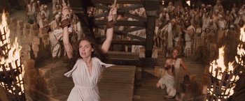 Movie still from “Clash of the Titans” (2010), directed by Louis Leterrier – A woman in a white dress holding onto a rope; Medium shot, High angle