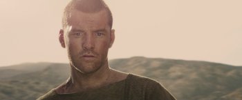 Movie still from “Clash of the Titans” (2010), directed by Louis Leterrier – A person wearing a shirt; Close Up shot, Over the shoulder angle