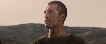 Movie still from “Clash of the Titans” (2010), directed by Louis Leterrier – A person wearing a shirt; Close Up shot, Low angle