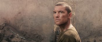 Movie still from “Clash of the Titans” (2010), directed by Louis Leterrier – A person wearing a shirt; Close Up shot, Over the shoulder angle