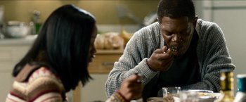 Movie still from “Cleaner” (2007), directed by Renny Harlin – A man and a woman eating food at a table; Close Up shot, Over the shoulder angle
