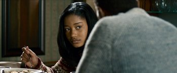 Movie still from “Cleaner” (2007), directed by Renny Harlin – A young black woman looking at a man; Close Up shot, Over the shoulder angle