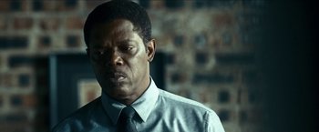 Movie still from “Cleaner” (2007), directed by Renny Harlin – A person wearing a shirt and a tie; Close Up shot, Low angle