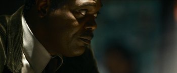 Movie still from “Cleaner” (2007), directed by Renny Harlin – A man's face in the dark; Close Up shot, Low angle