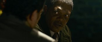 Movie still from “Cleaner” (2007), directed by Renny Harlin – A person wearing a suit and a tie; Close Up shot, Over the shoulder angle