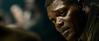Movie still from “Cleaner” (2007), directed by Renny Harlin – A man's face in a dark room; Close Up shot, Low angle