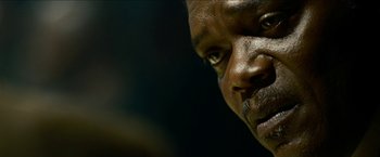 Movie still from “Cleaner” (2007), directed by Renny Harlin – A man's face in a dark room; Extreme Close Up shot, Low angle