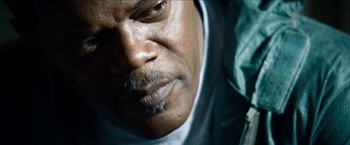 Movie still from “Cleaner” (2007), directed by Renny Harlin – A man's face with a mustache; Close Up shot, Low angle