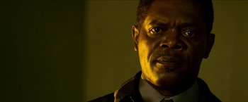 Movie still from “Cleaner” (2007), directed by Renny Harlin – A person wearing a suit and tie; Close Up shot, Low angle