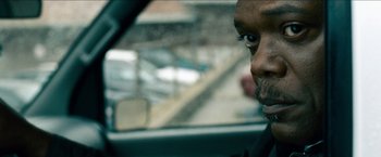 Movie still from “Cleaner” (2007), directed by Renny Harlin – A person in a car looking out of the window; Close Up shot, Over the shoulder angle