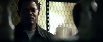 Movie still from “Cleaner” (2007), directed by Renny Harlin – A man in a jail cell with bottles in front of him; Close Up shot, Low angle