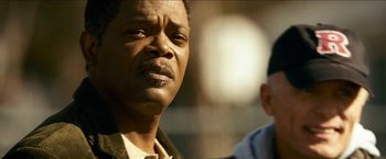 Movie still from “Cleaner” (2007), directed by Renny Harlin – A man's face in a movie scene; Close Up shot, Low angle