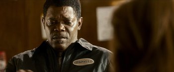 Movie still from “Cleaner” (2007), directed by Renny Harlin – A person wearing a black jacket; Close Up shot, Over the shoulder angle
