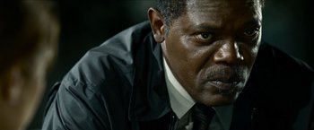 Movie still from “Cleaner” (2007), directed by Renny Harlin – A person wearing a suit and tie; Close Up shot, Low angle